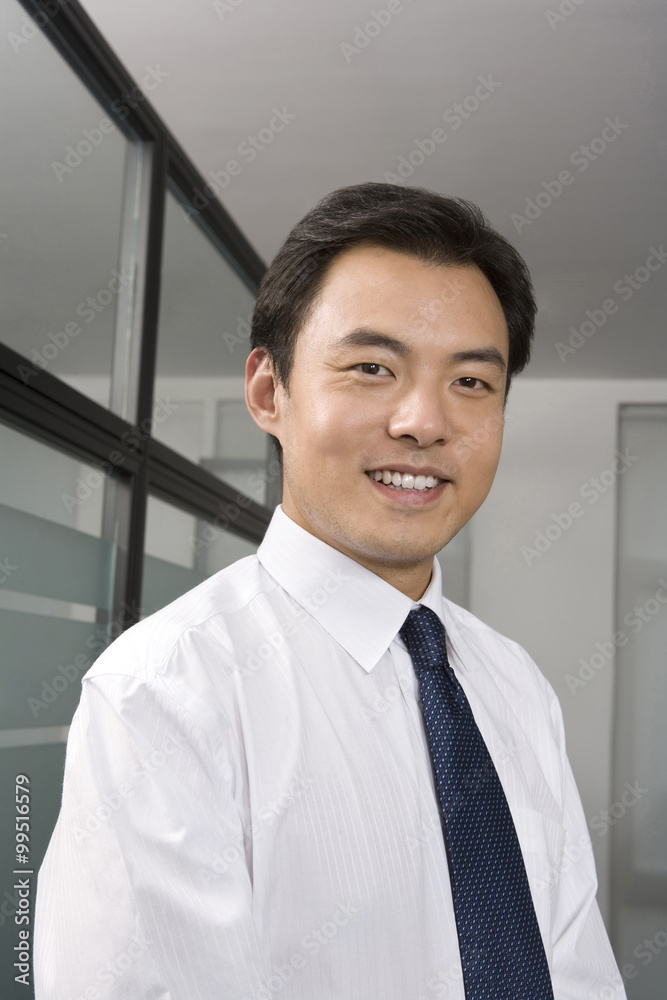 Portrait of young businessman in office