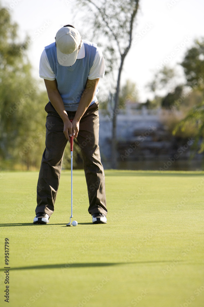 Golfer putting on the Green