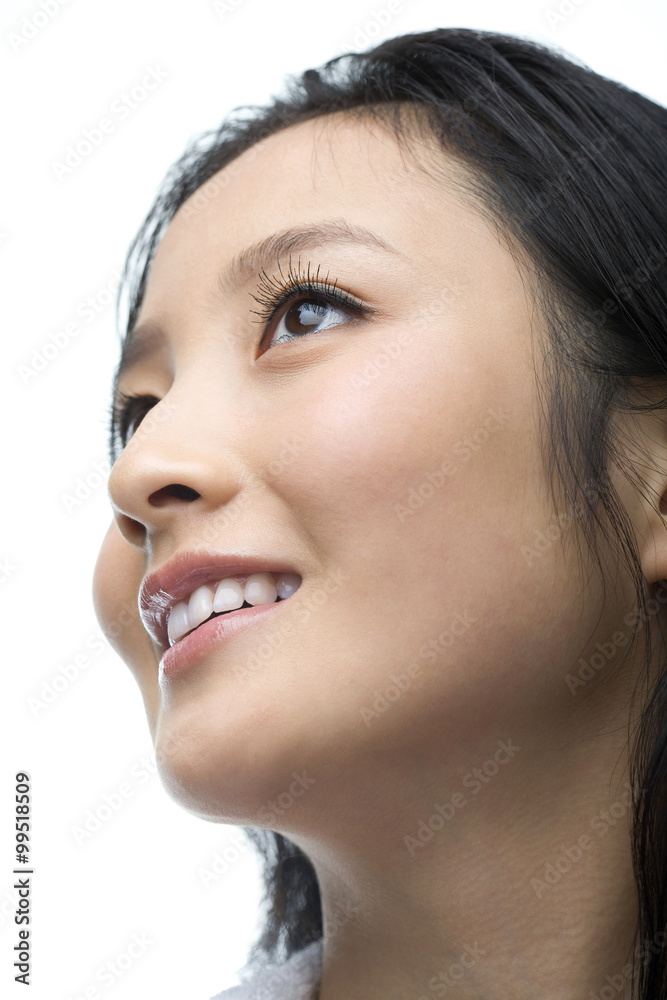 Young woman looking up