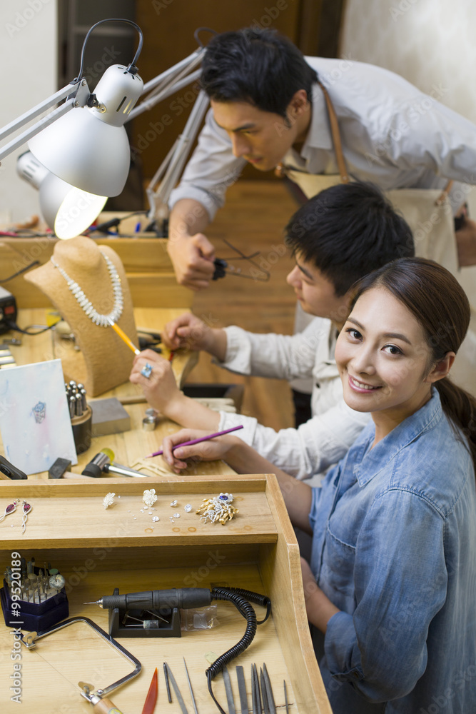 Jewelers working in studio