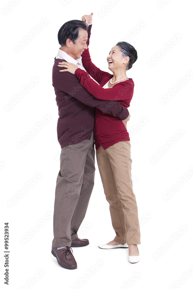 Happy senior couple dancing, face to face