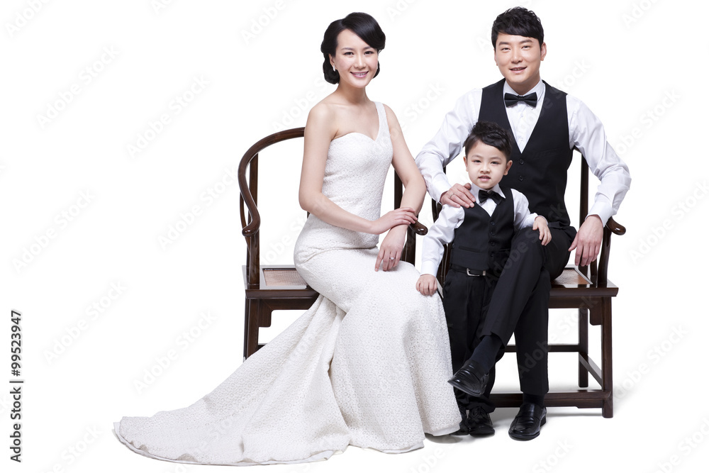 Happy young family sitting in chairs