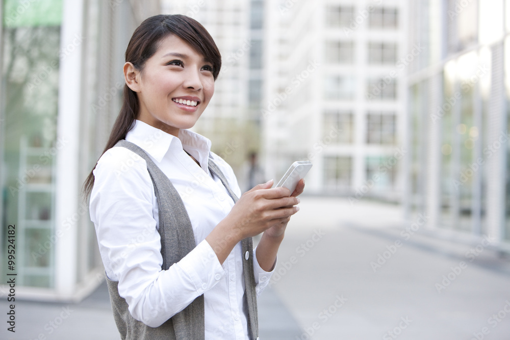 Young businesswoman and cellphone