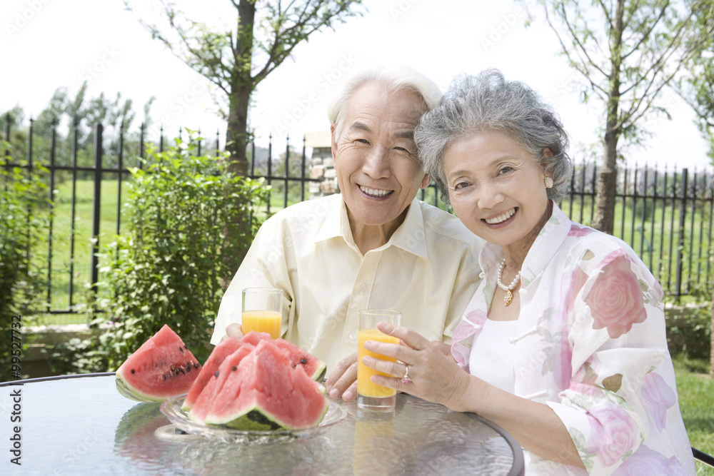 Senior couple having fruits