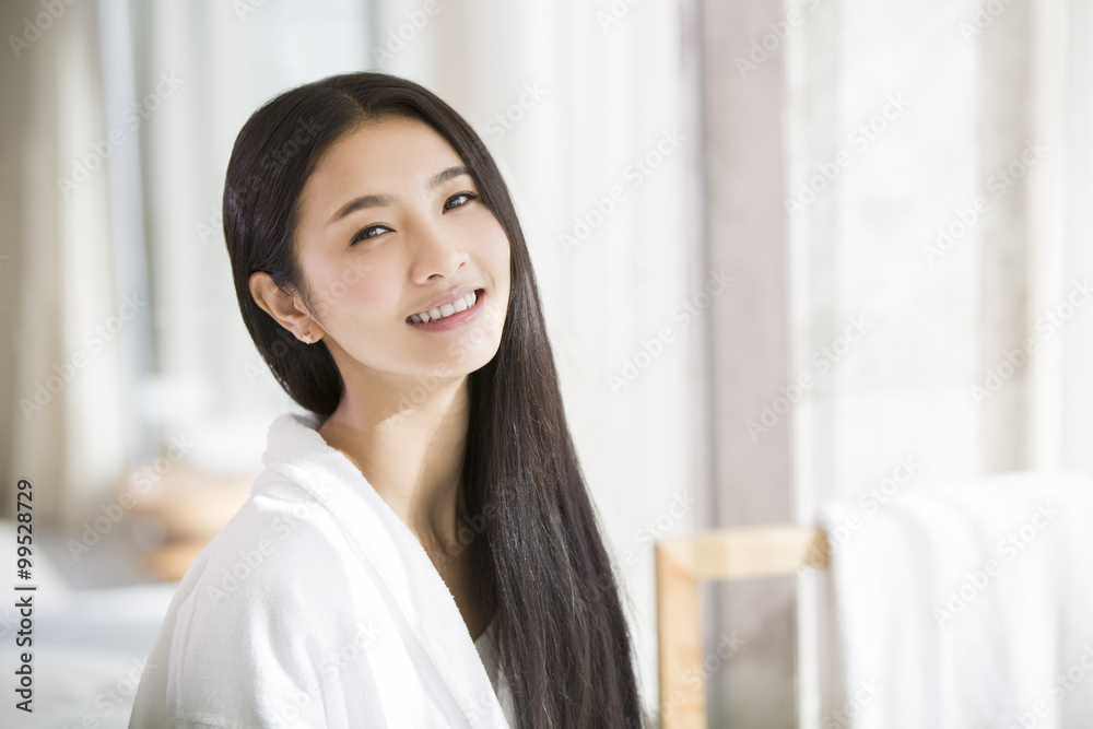 Portrait of young woman with long hair