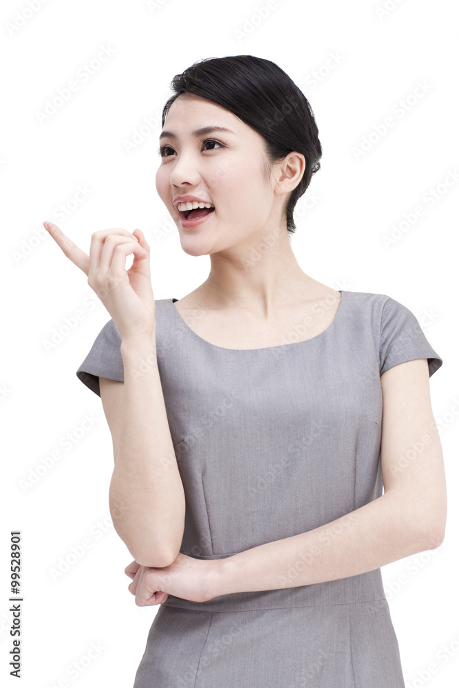 Young businesswoman pointing aside