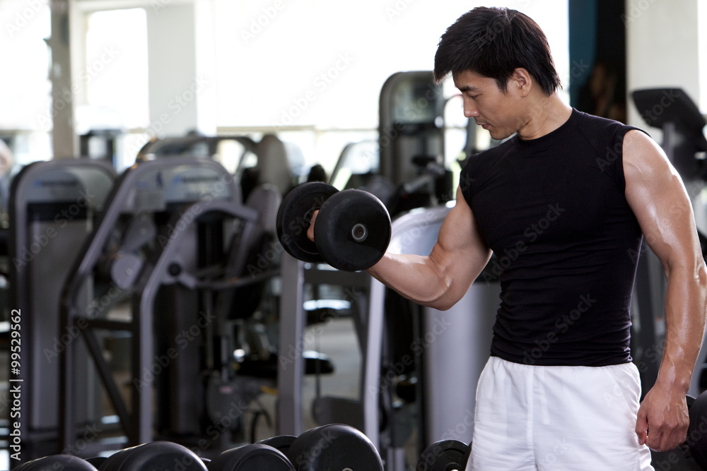 Mid-Adult Man Lifting Weights