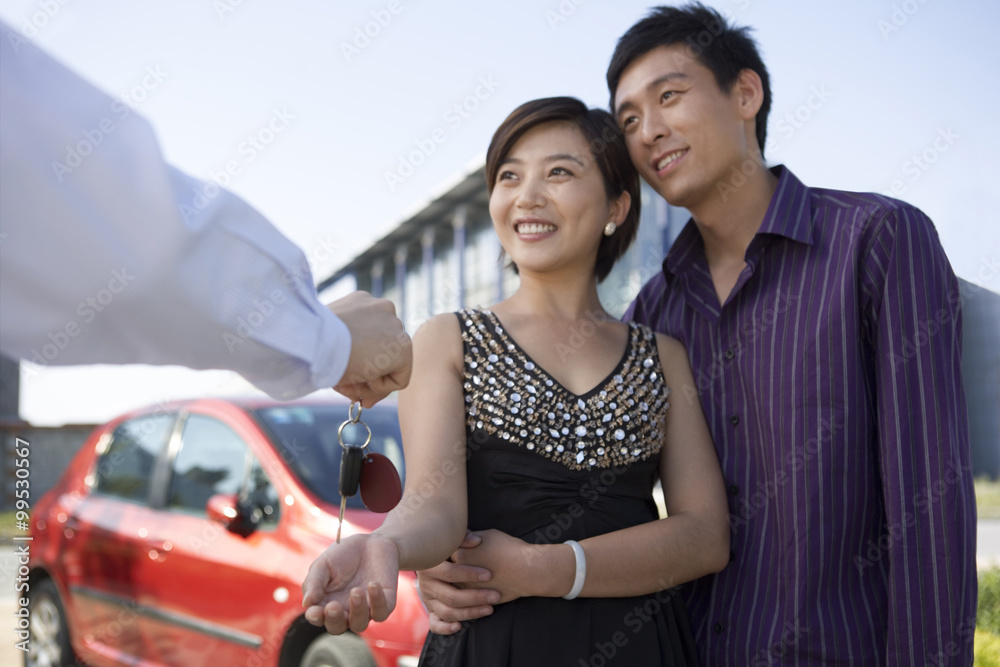 Young couple buys a new car