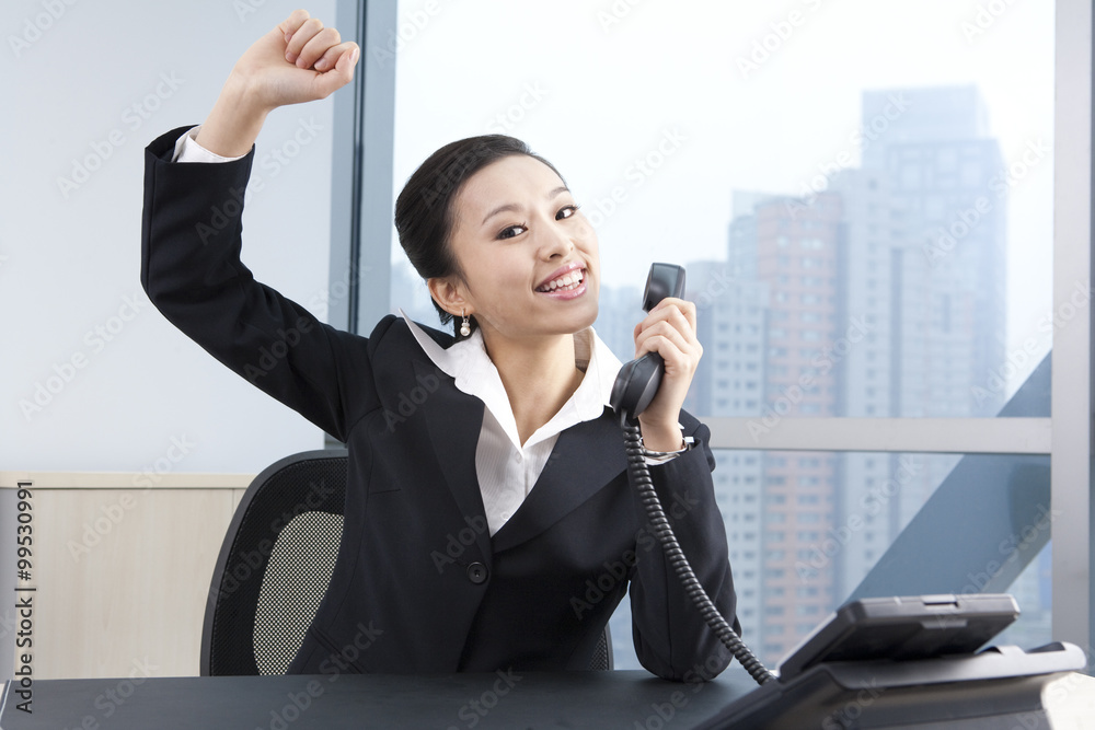 Businesswoman Talking On Phone, Cheering