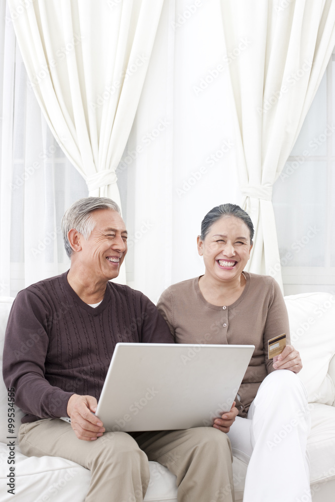 Senior couple online shopping