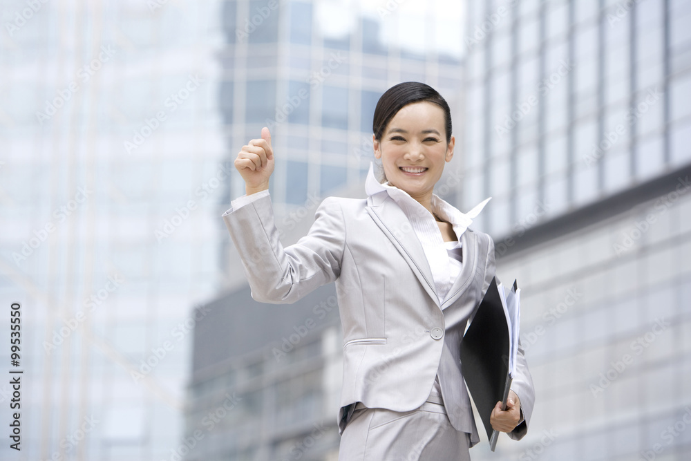 Businesswoman celebrating