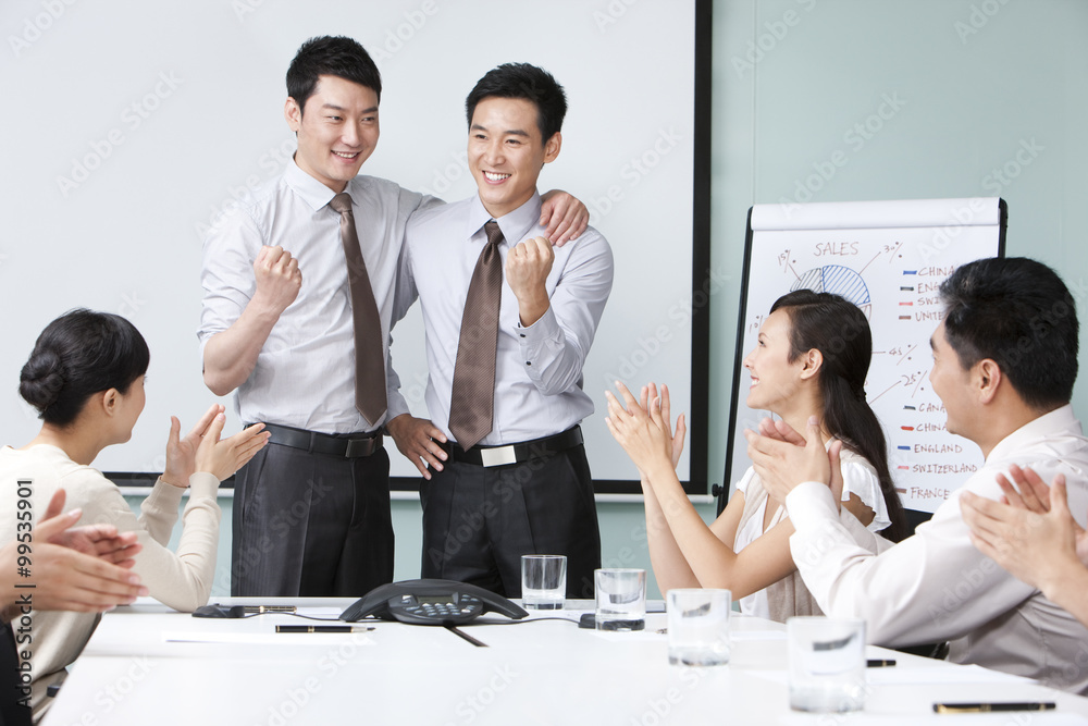 Business Team Applauding Young Executives