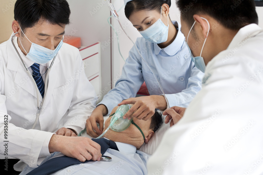 Medics treating a patient in an ambulance