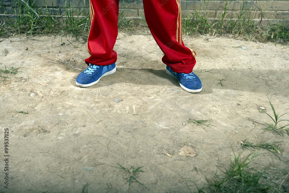 Low Section Shot Of Teenage Boy Wearing Casual Clothing