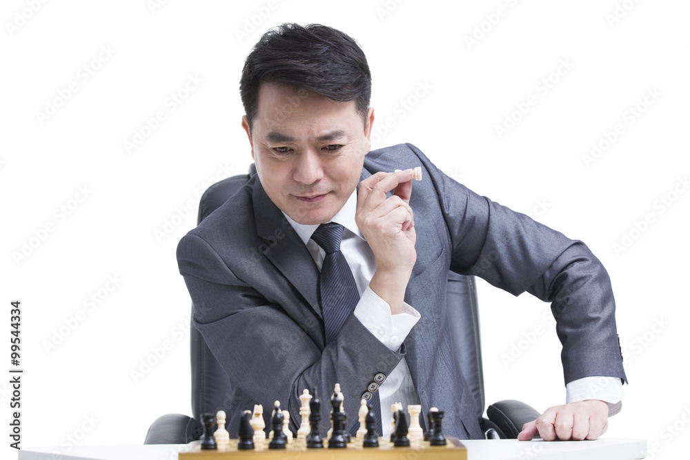 Businessman playing chess