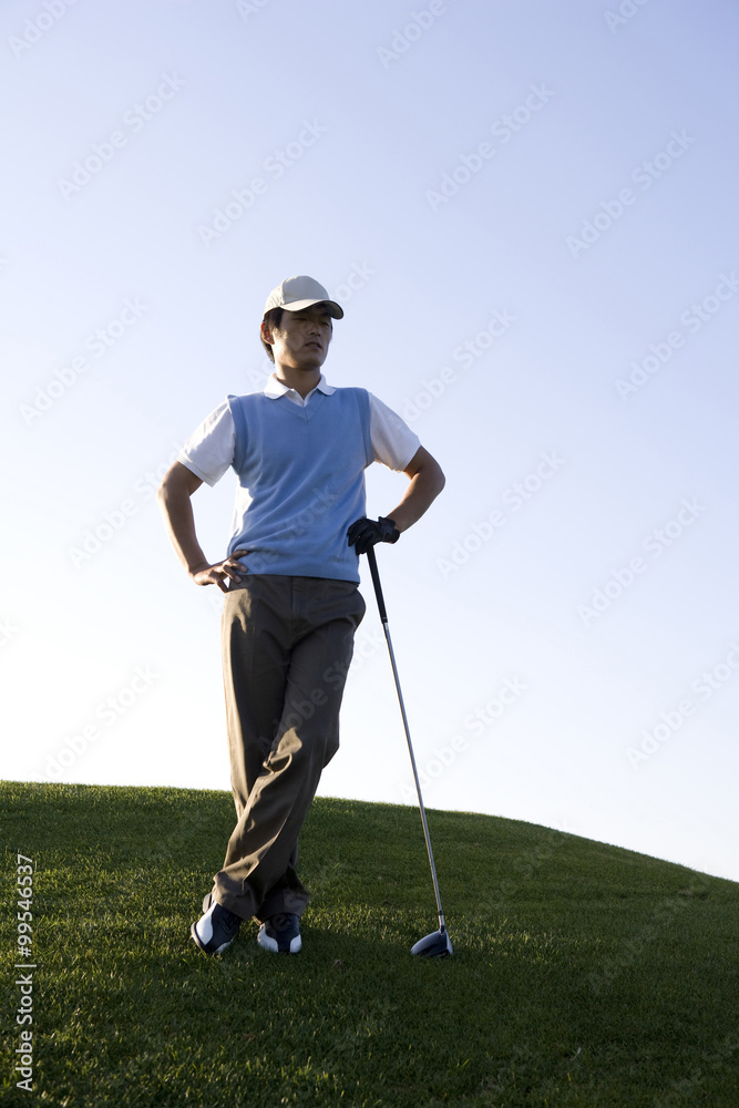 Golfer taking a rest on the course