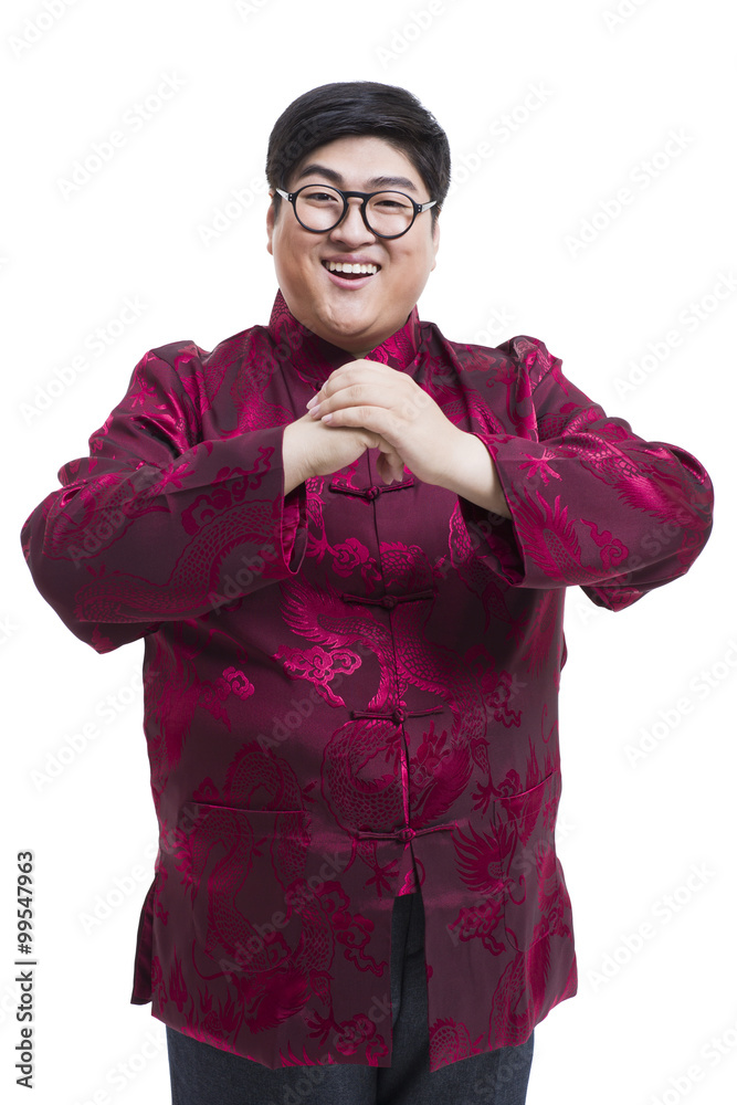 Young man in Tang suit greeting for Chinese New Year