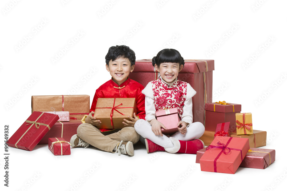 Happy children receiving many Chinese new year gifts