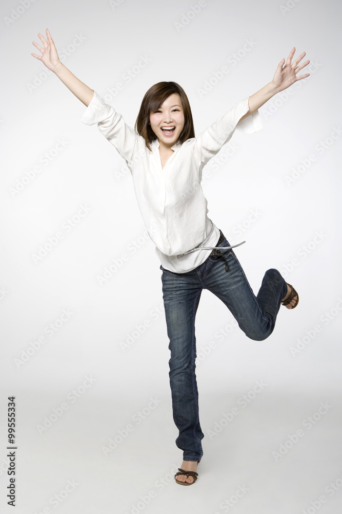 Portrait of Young Woman with Arms Outstretched