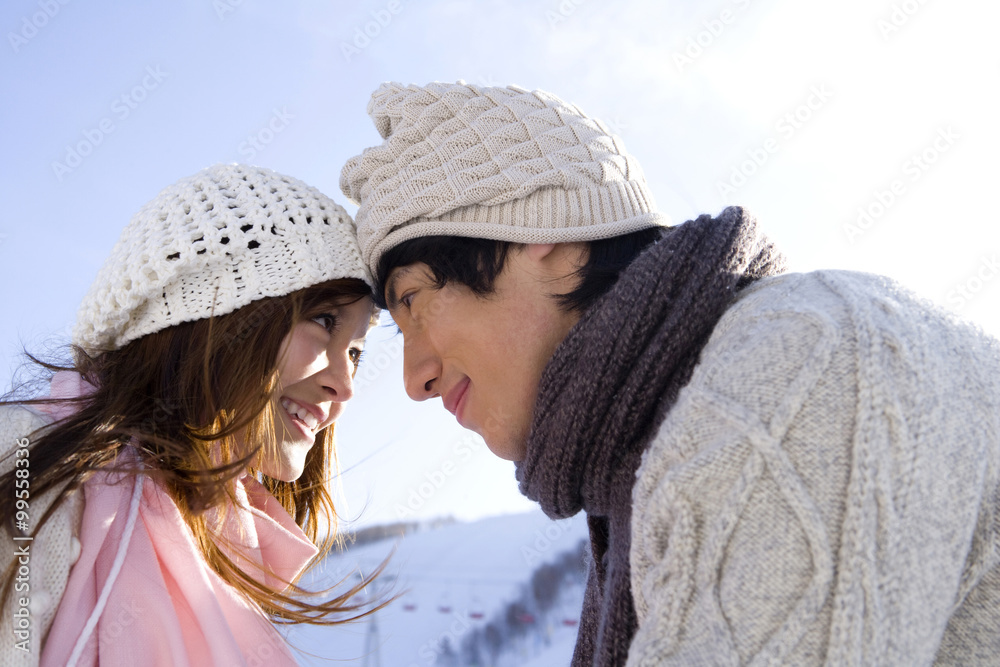 Young couple face to face with each other