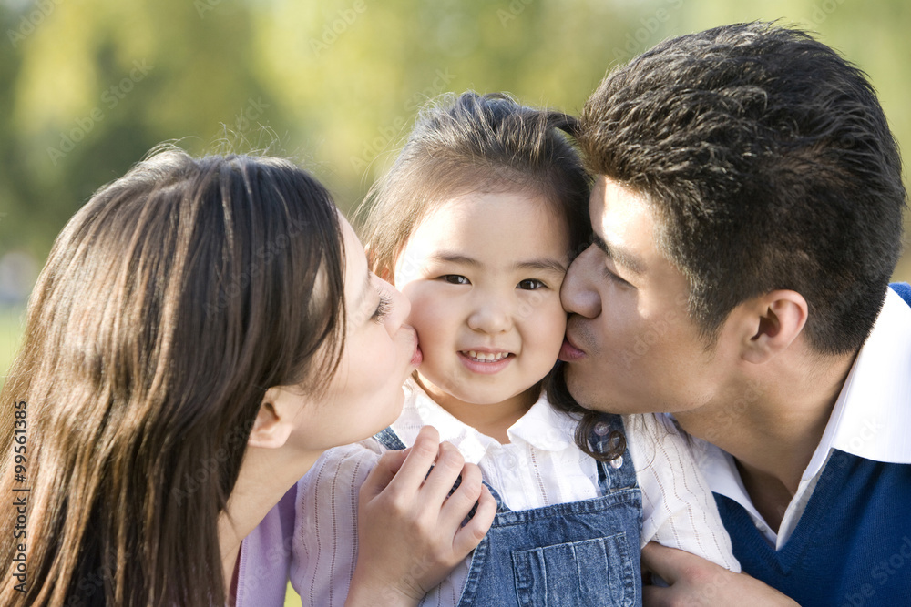 Portrait of young family at the park