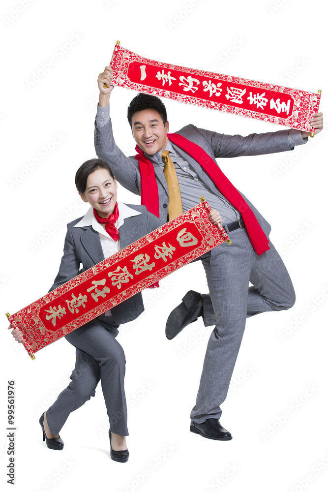 Business people with couplets celebrating Chinese New Year