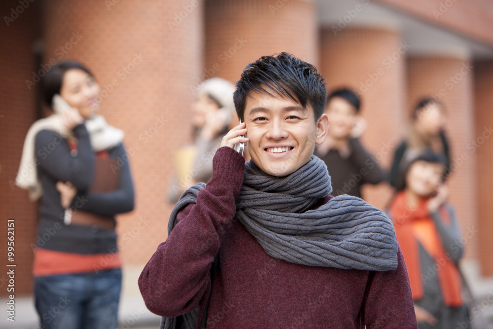 College students on the phone on campus