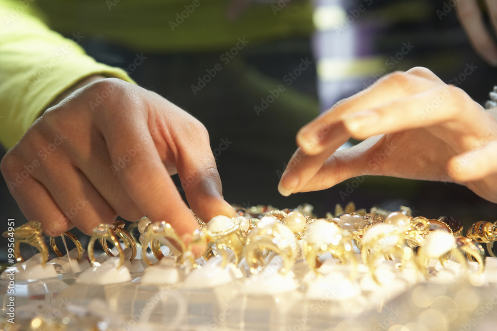 Person Looking At Gold Rings