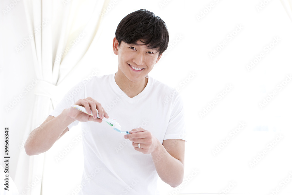 Young man preparing for tooth brush