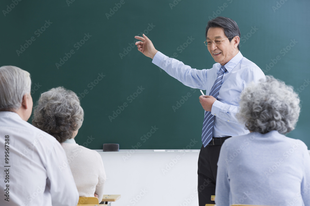 Senior adults having class at school