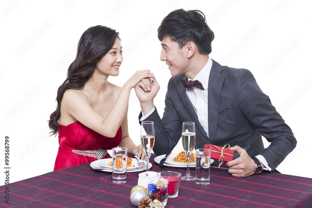 Romantic young couple dating in restaurant