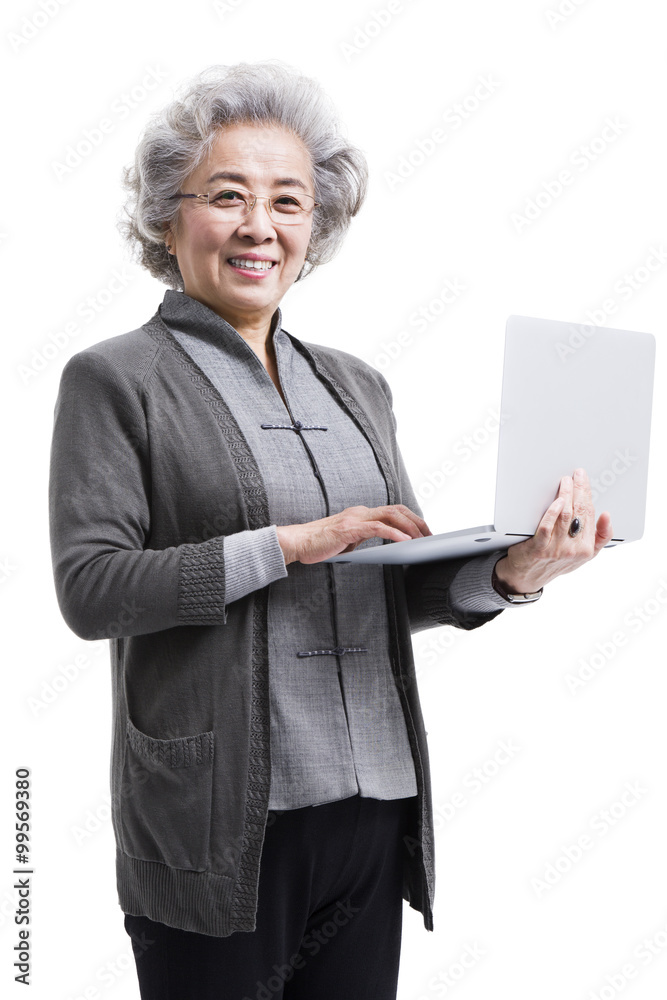 Happy senior woman with laptop