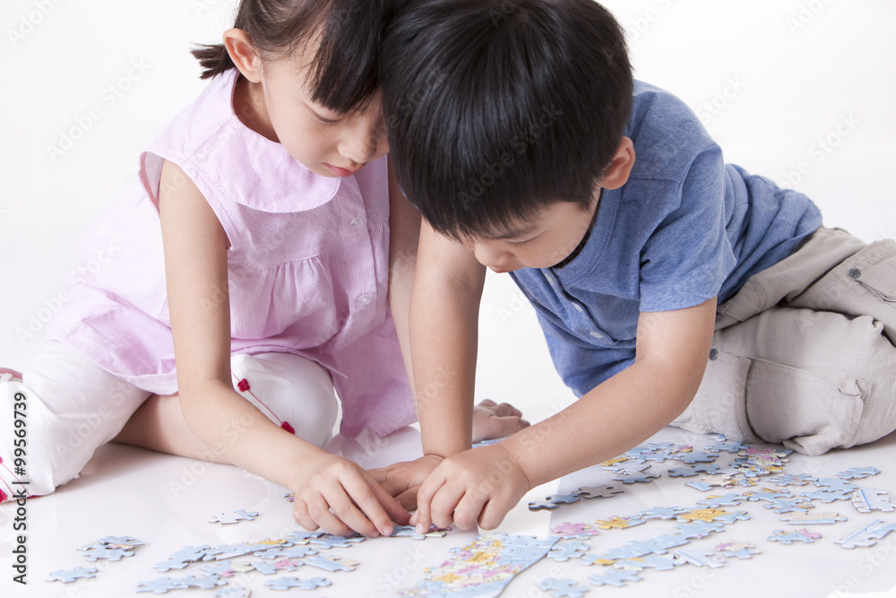 Girl playing jigsaw puzzles