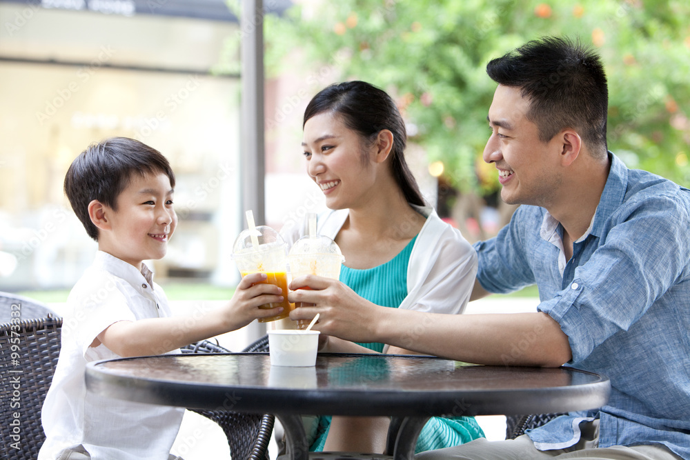 Family enjoying cold drink together