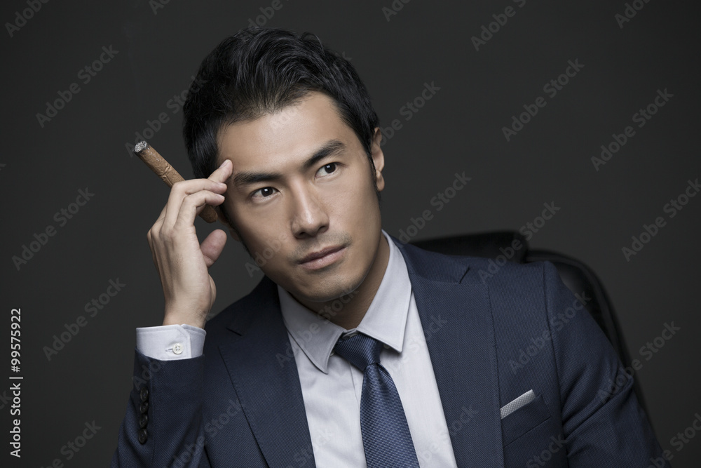 Confident businessman with cigar