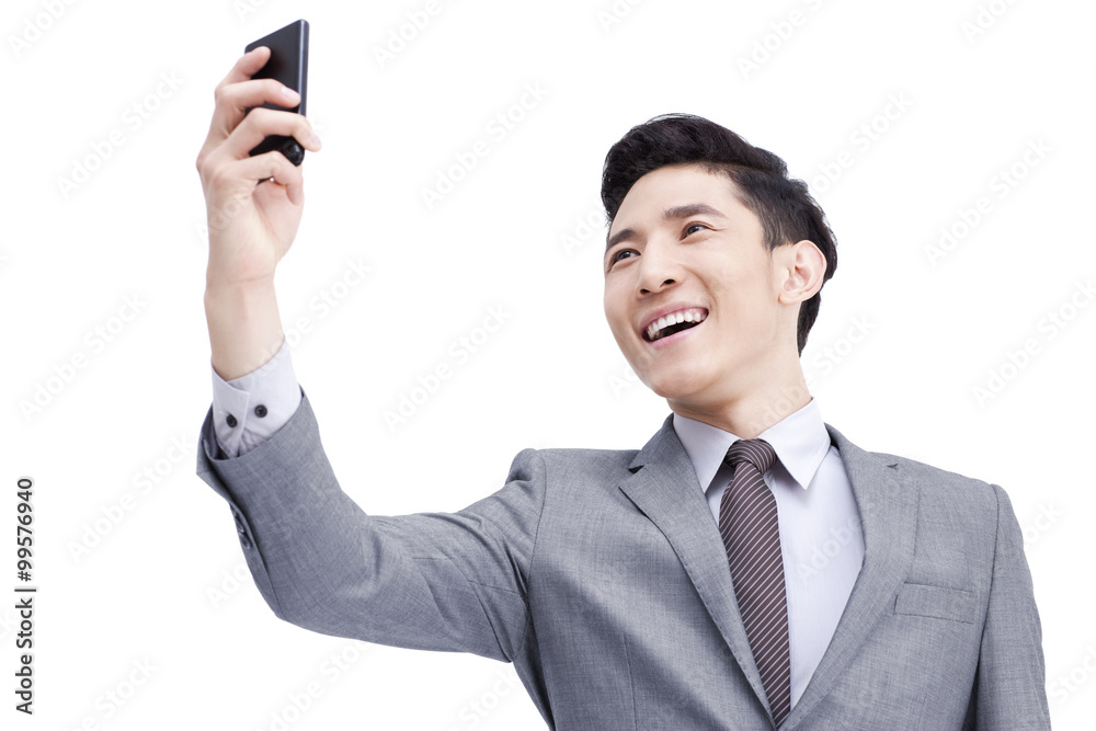 Young businessman photonic with mobile phone