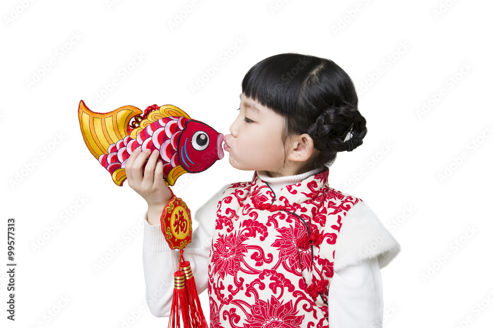 Happy girl kissing carp ornament celebrating Chinese new year