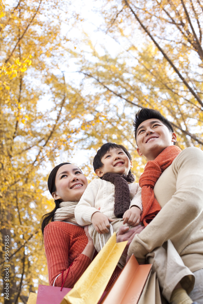 Young family shopping in Autumn