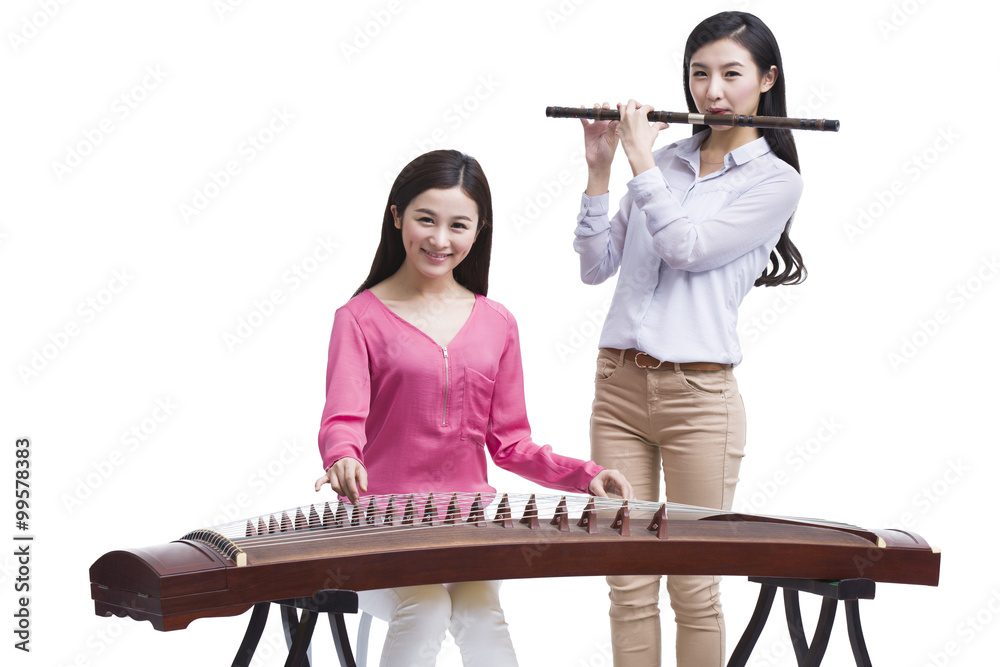 Young women playing traditional Chinese musical instruments