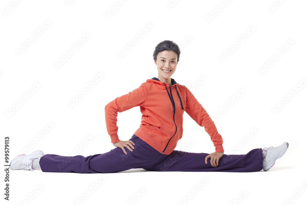 Senior woman doing the splits