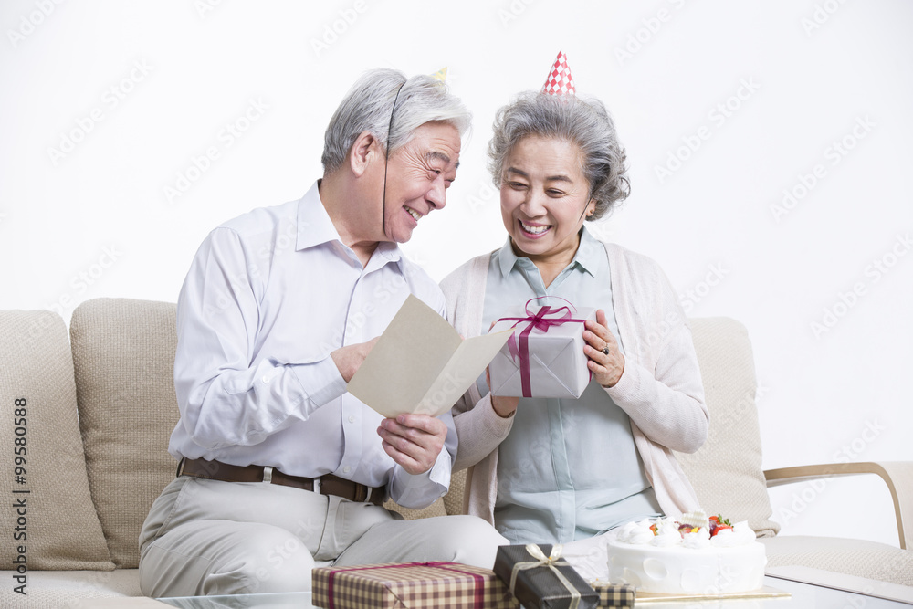 Senior adults having birthday party