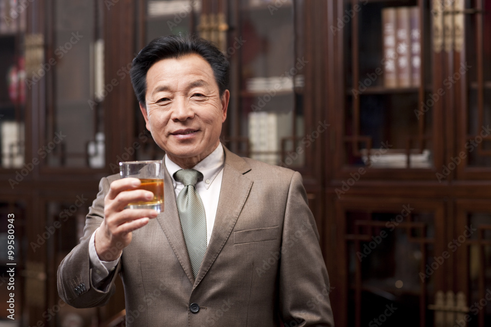 Successful businessman toasting