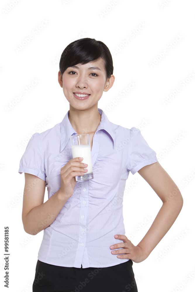 Businesswoman Holding a Glass of Milk