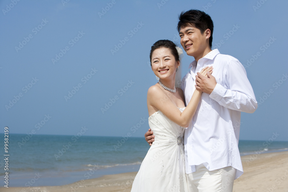 Newlywed couple on the beach