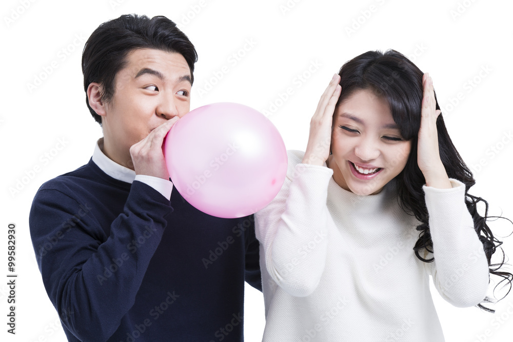 Happy young couple with balloon