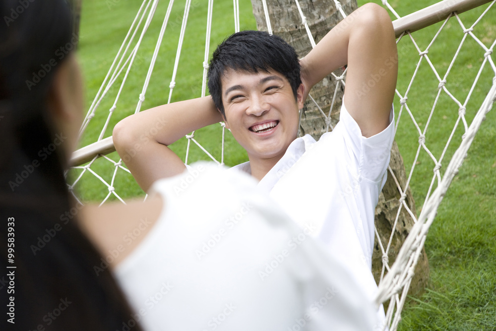 Portrait of a young couple in a hammock