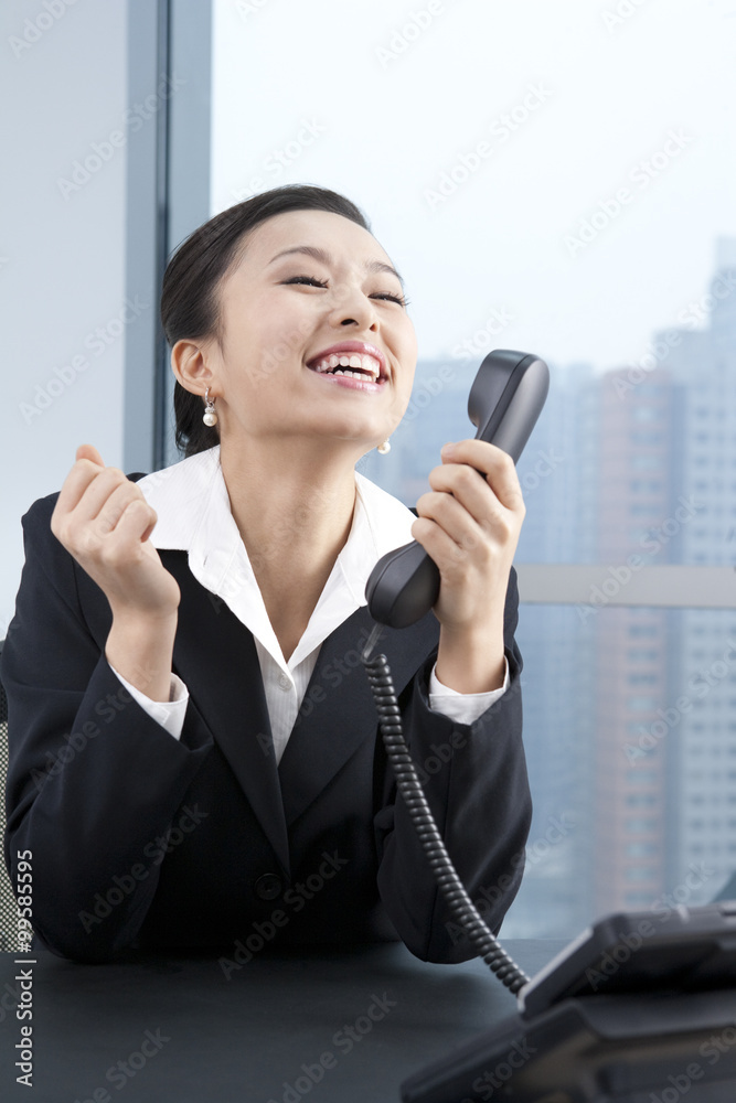 Businesswoman Talking On Phone, Cheering