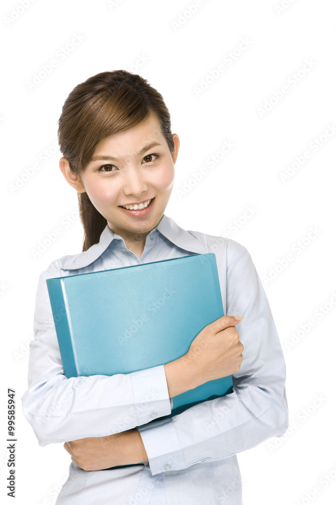 Smiling young businesswoman holding file folder