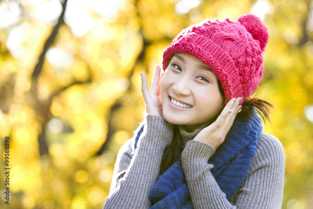 Young Woman in a Park in Autumn