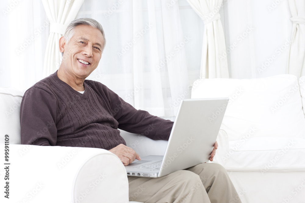 Senior man using laptop